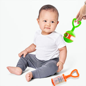 Kid playing with rattle set
