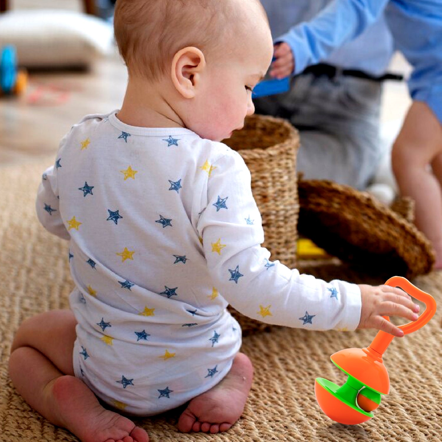 Kid Playing With Rattle Set