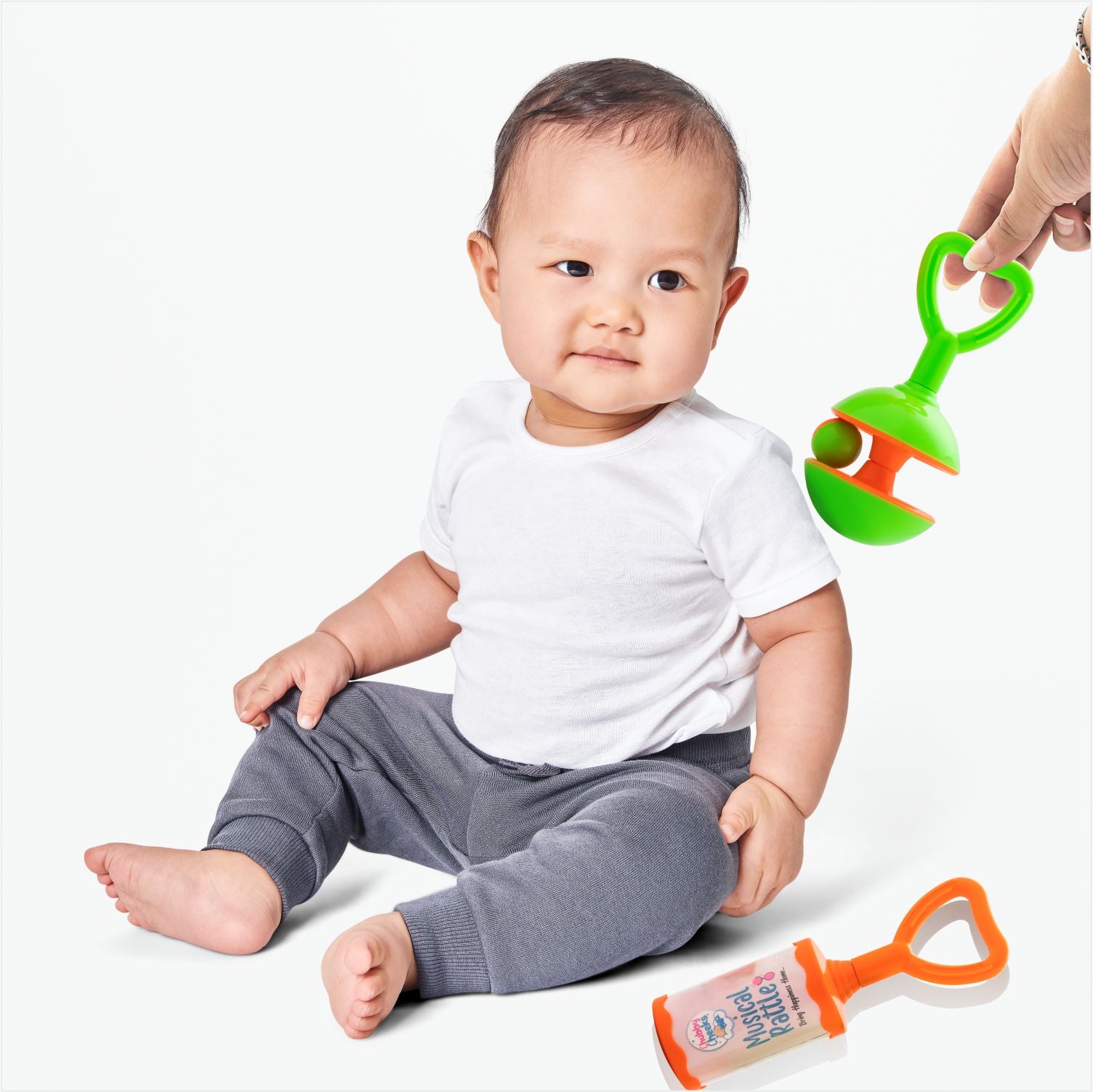 Kid playing with rattle set