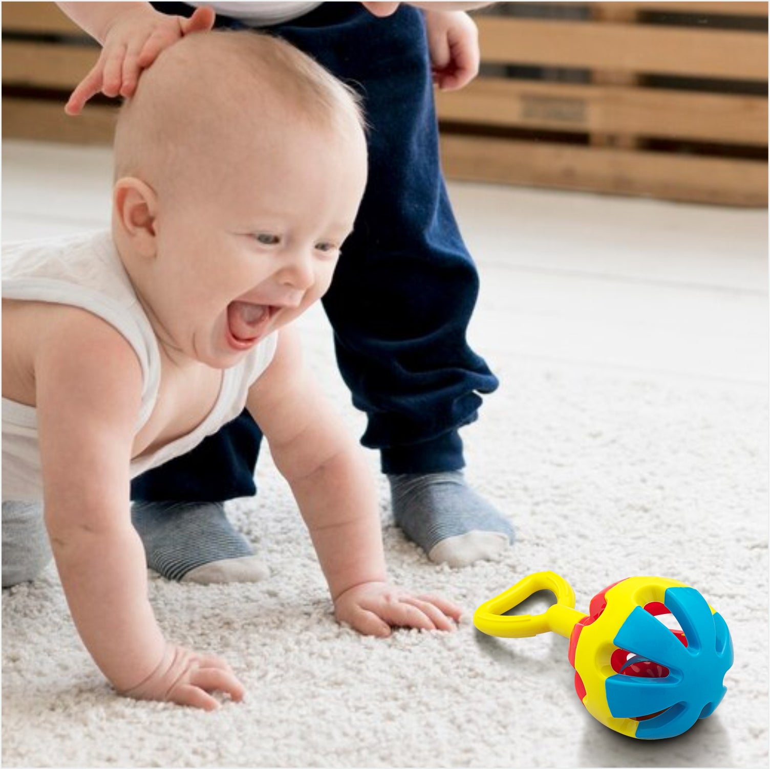 Kid Playing With Rattle Set