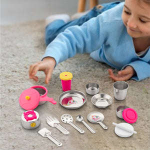 kid playing with realistic kitchen toys